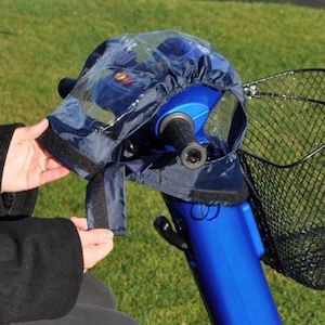 Mobility Scooter Control Panel Cover over blue scooter