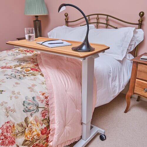NRS Healthcare Easylift Overbed Table Lifestyle